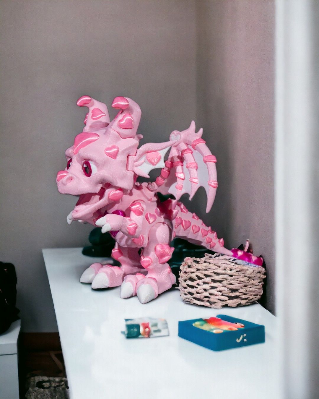 a group of pink flowers sitting on a table 